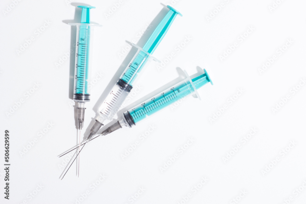 Medical syringe on a white background. A syringe for injection. The concept of health and beauty Medical syringe on a white background. A syringe for injection. The concept of health and beauty