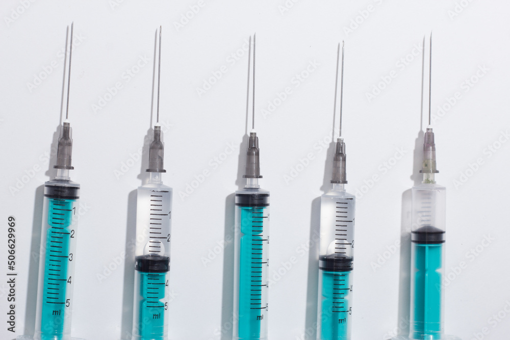 Medical syringe on a white background. A syringe for injection. The concept of health and beauty Medical syringe on a white background. A syringe for injection. The concept of health and beauty