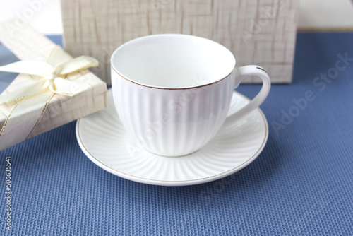 Classic white cup and saucer as a gift.
