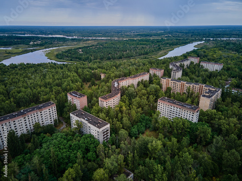 Aerial view of Chernobyl Ukraine exclusion zone Zone of high radioactivity, Ruins of abandoned ghost town Pripyat city, Ruins of buildings. photo