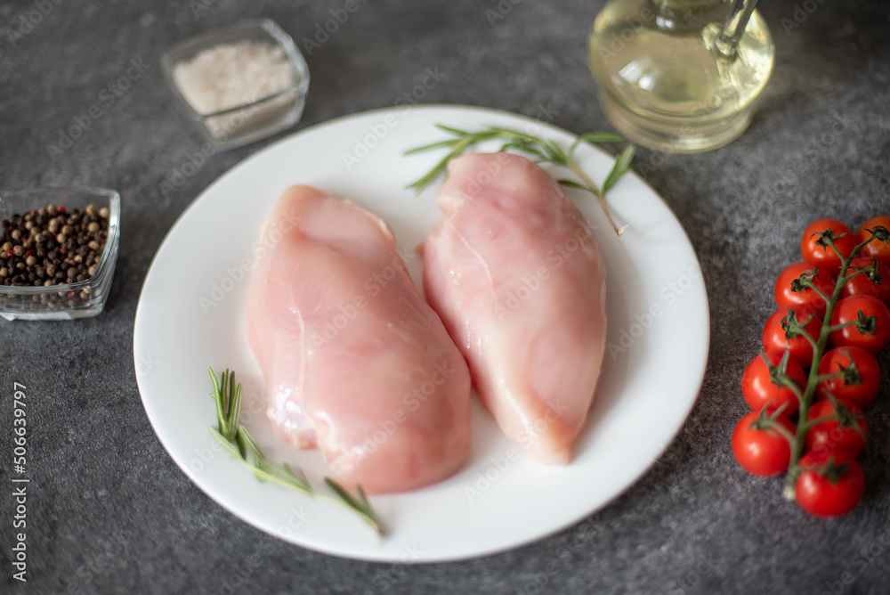 Raw chicken fillet on stone background Raw chicken fillet on stone background