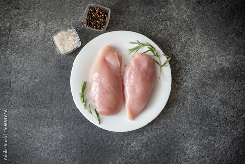 Raw chicken fillet on stone background