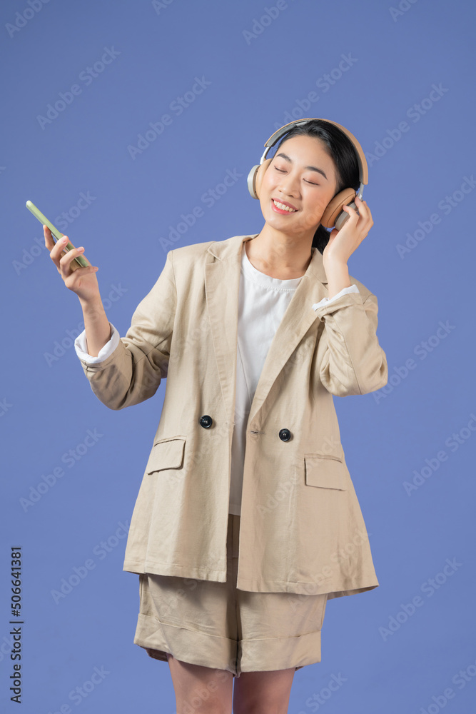 Happy woman with wireless headphones in her ea Happy woman with wireless headphones in her ea