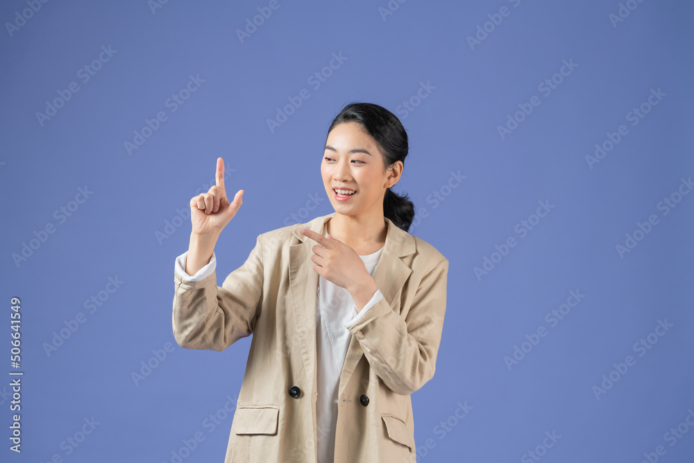 Asian girl holding something invisible in his hands, isolated Asian girl holding something invisible in his hands, isolated