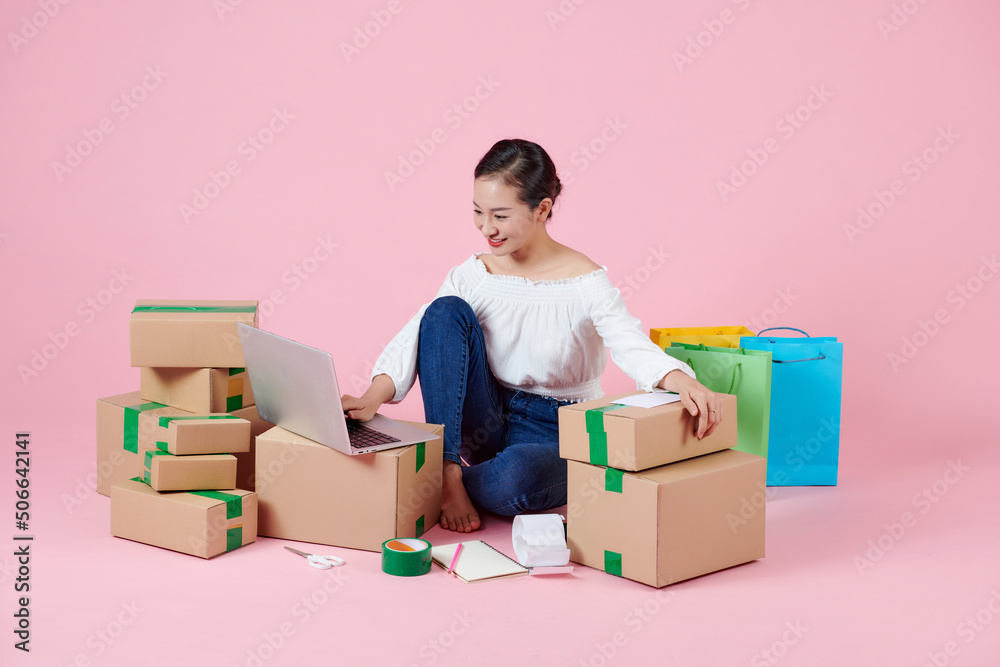 woman working at home office packaging on background woman working at home office packaging on background