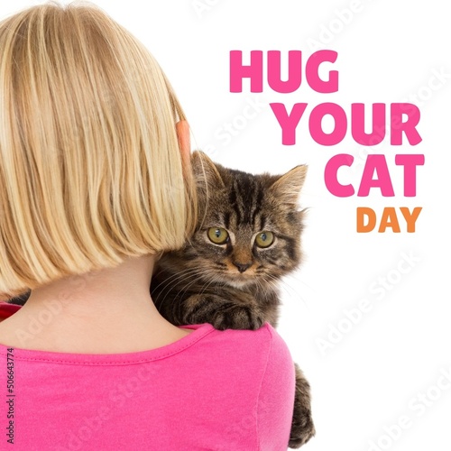 Digital composite of hug your cat day text by blond caucasian girl with pet on white background
