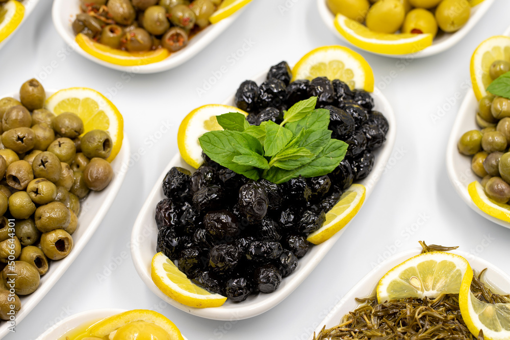 Olives. Varieties of olives on white background. Healthy food. Selective focus olive. close up Olives. Varieties of olives on white background. Healthy food. Selective focus olive. close up
