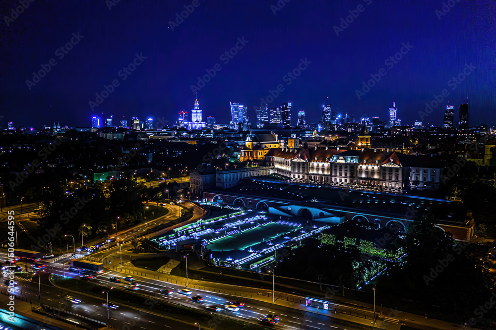 Aerial view of old buildings, castles and a church in the old city of Warsaw. Cityscape of old buildings and architecture in the old town in Warsaw. Night time