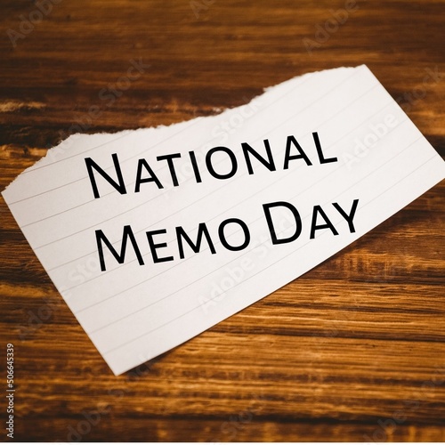 Composite image of white torn paper with national memo day text on wooden table, copy space