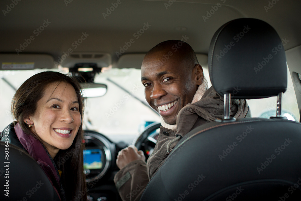 Portrait happy couple inside car Portrait happy couple inside car