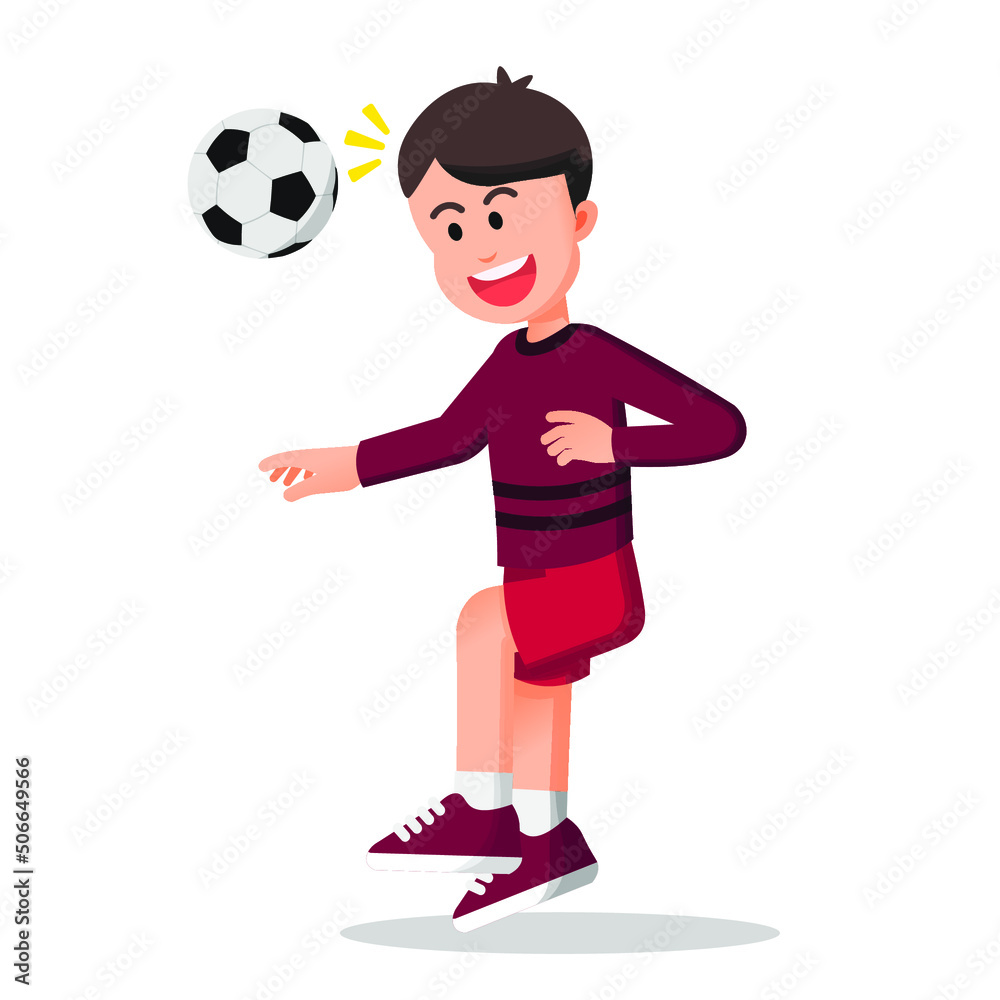 a happy boy heads a soccer ball