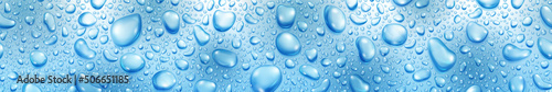 Banner of big and small realistic water drops in light blue colors, with seamless horizontal repetition