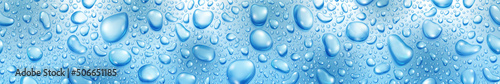 Banner of big and small realistic water drops in light blue colors  with seamless horizontal repetition