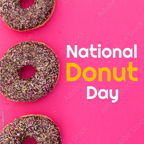 Directly above of national donut day text by food on pink background