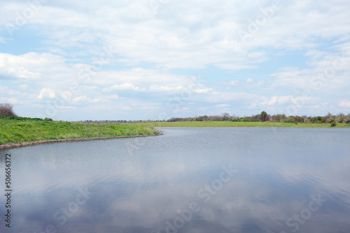 River near village under sky with clouds. Picturesque landscape © New Africa