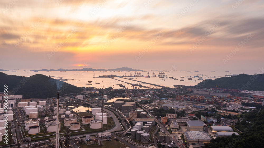Aerial view of Oil and gas industry - refinery, and Petrochemical plant on island at evening sunset background