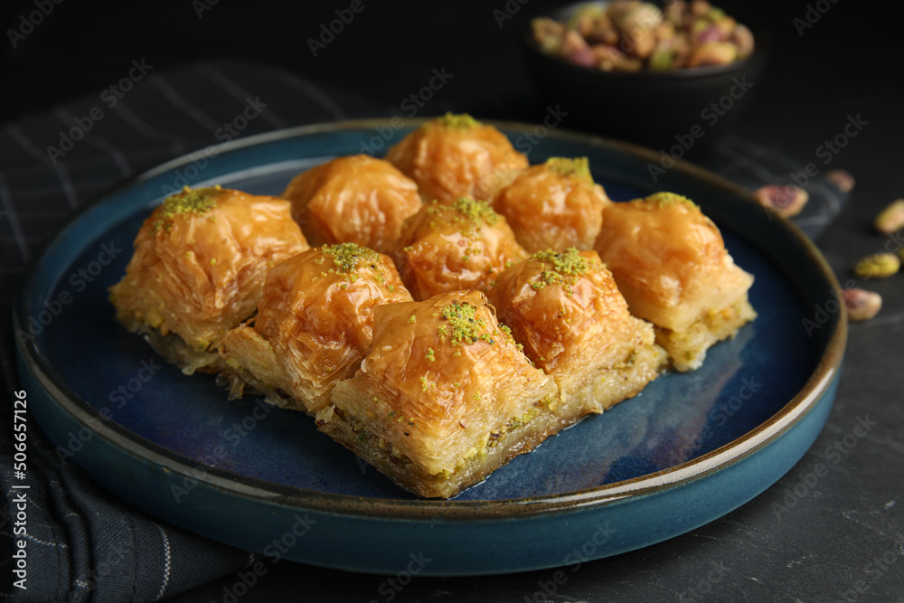 Delicious sweet baklava on black table, closeup Delicious sweet baklava on black table, closeup