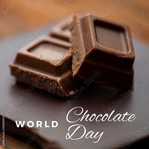 Digital composite image of chocolate bars with world chocolate day text on table, copy space