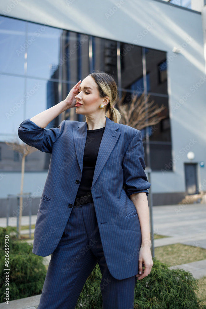 Fototapeta premium Portrait of a pretty business woman in a formal suit