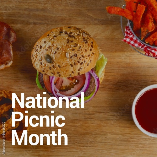 National picnic month text over burger with sauce and french fries on table