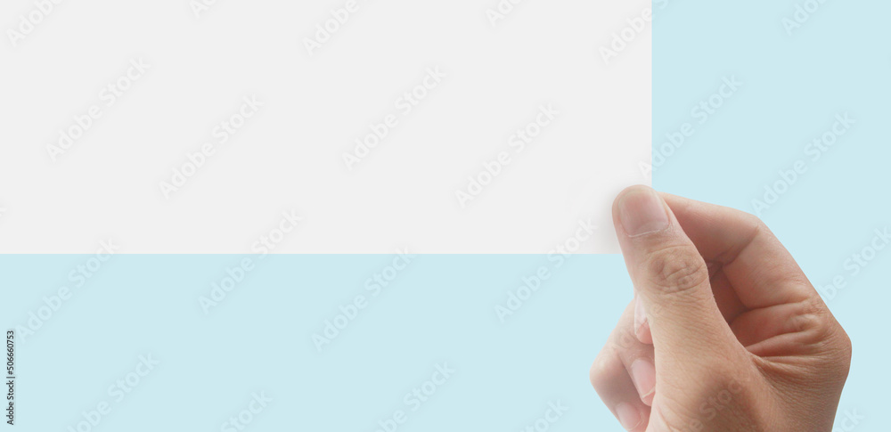 Hands holding paper blank for letter paper. Hands holding paper blank for letter paper.