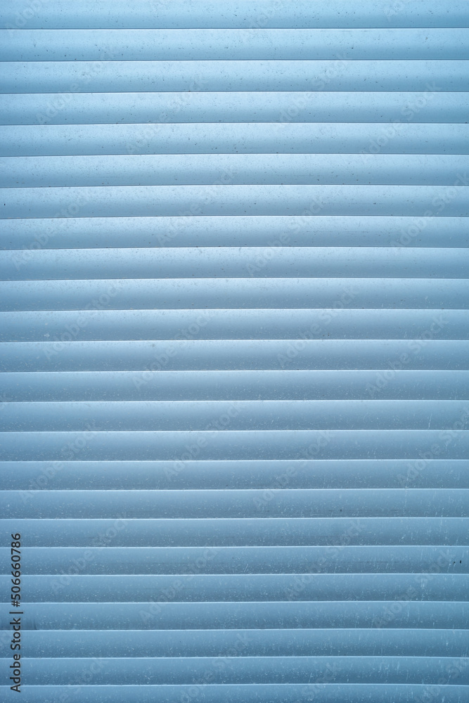 Dirty jalousie for shop window made of metal Aluminum as a background, closeup, derails. Dirty jalousie for shop window made of metal Aluminum as a background, closeup, derails.