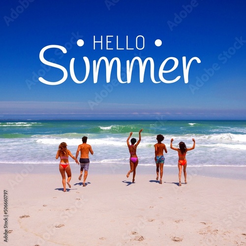 Composite of hello summer text with multiracial friends enjoying at beach