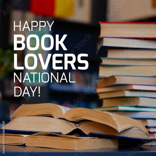 Digital composite of stack of books on table and happy book lovers national day text, copy space