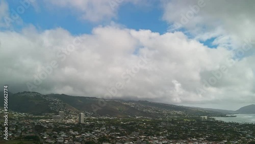 Time lapse of Kahala Oahu on a sunny day with clouds and blue sky photo