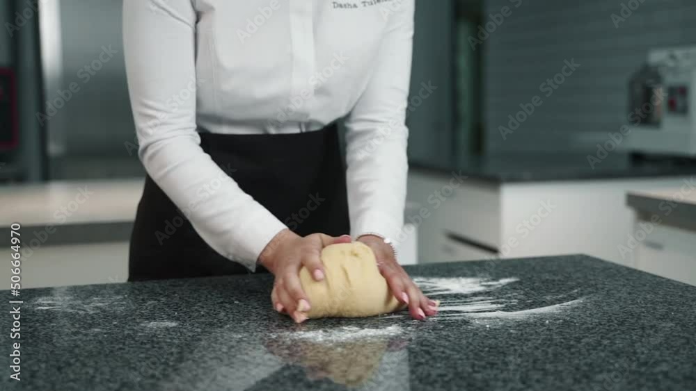 girl cook rolls dough on the table girl cook rolls dough on the table
