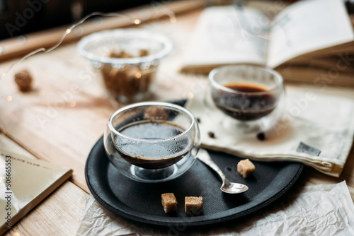 Canvastavla Coffee in glass cup on wooden background