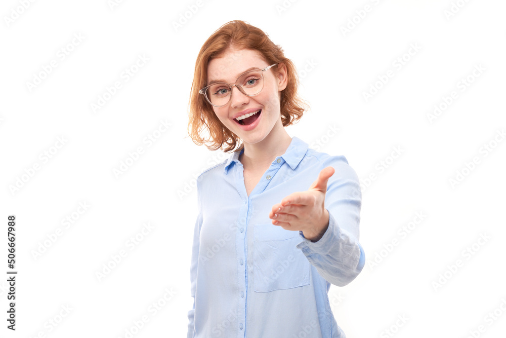 Portrait of friendly redhead girl chooses you, points finger at the camera isolated on white background Portrait of friendly redhead girl chooses you, points finger at the camera isolated on white background