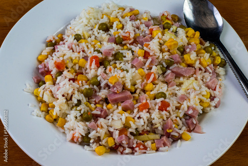 white rice top with  diced han and mixed vegetables photo