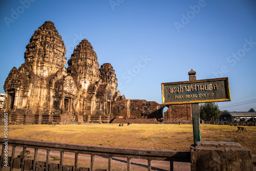 Pra Prang Sam Yod or Phra Prang Sam Yot ruin temple with monkeys, in Lopburi, Thailand photo