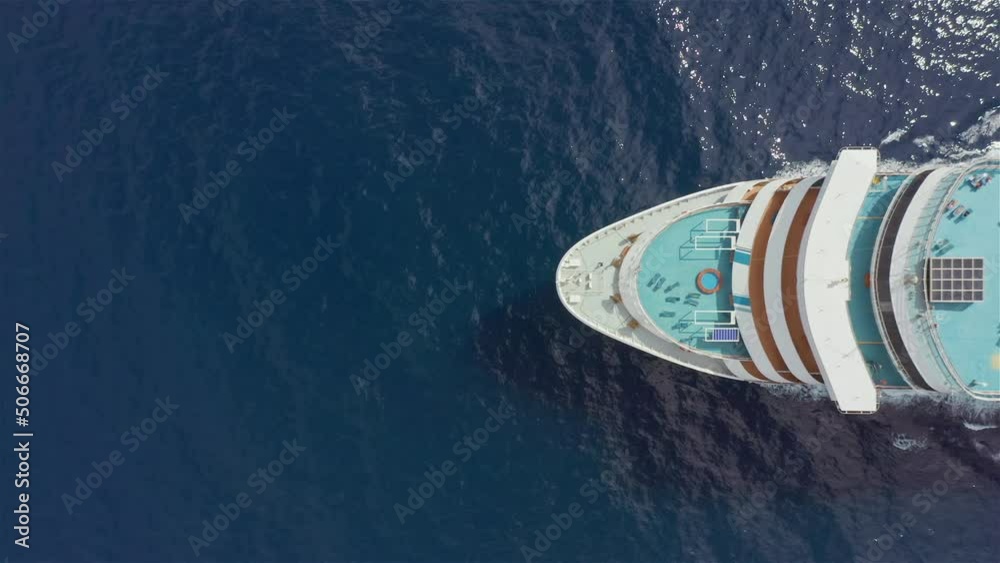 Cruise ship sailing in the ocean aerial view from above. Romantic holiday vacation on luxury cruise liner. Travel across ocean summer journey concept