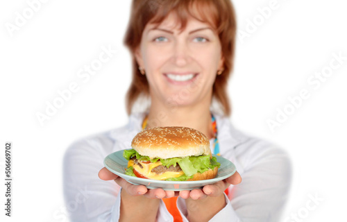 Portrait of young beautiful woman holding burger