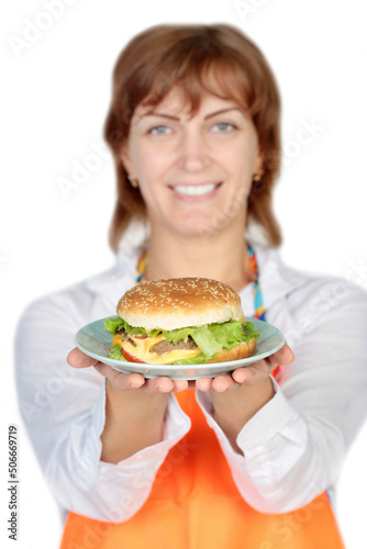 Portrait of young beautiful woman holding burger