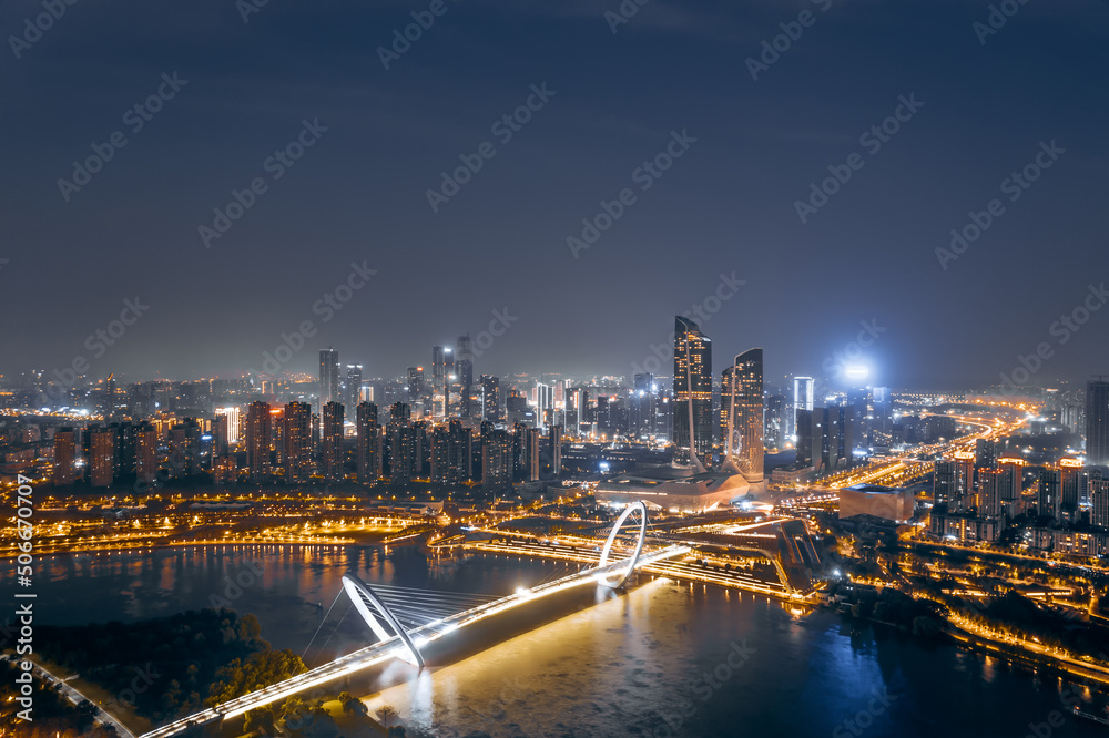 Aerial night view of the city skyline of Nanjing Youth Olympic Center and Nanjing Eye Bridge in Nanjing, Jiangsu, China