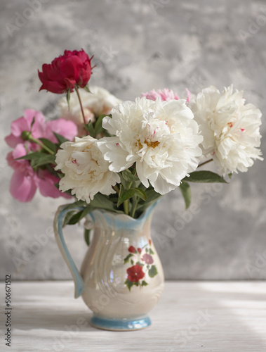 Still life with white and pink peonies in a white vase © Igor Syrbu