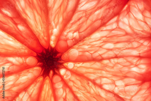 Close-up of sliced grapefruit, macro, creative background.