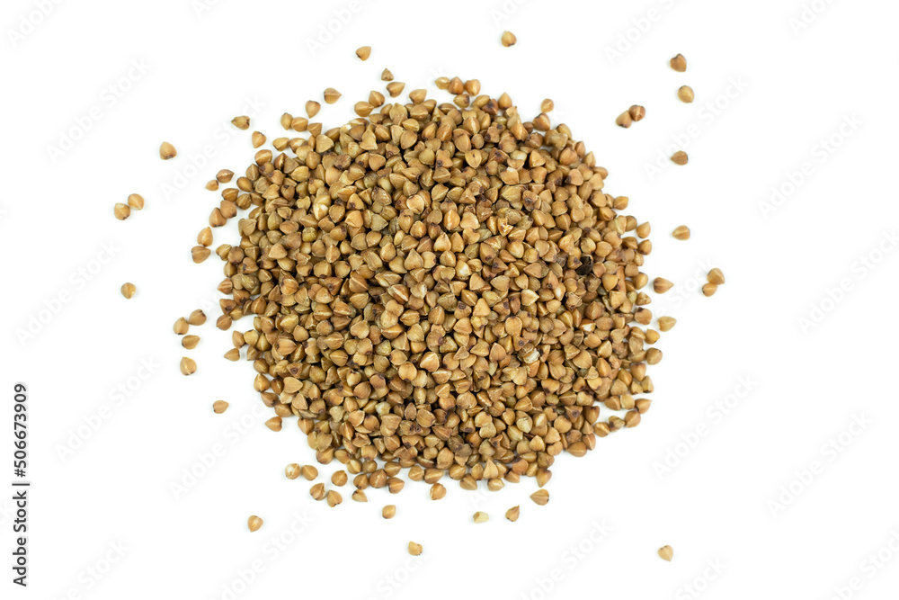 Brown buckwheat groats close-up on a white isolated background (isolate). Brown buckwheat groats close-up on a white isolated background (isolate).