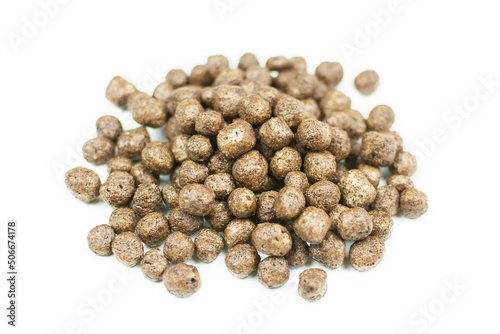 Corn chocolate balls close-up on a white isolated background. A quick healthy dry breakfast, add milk. Side view.