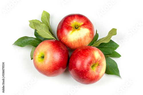 Three large juicy red apples with leaves on a white isolated (isolate) background