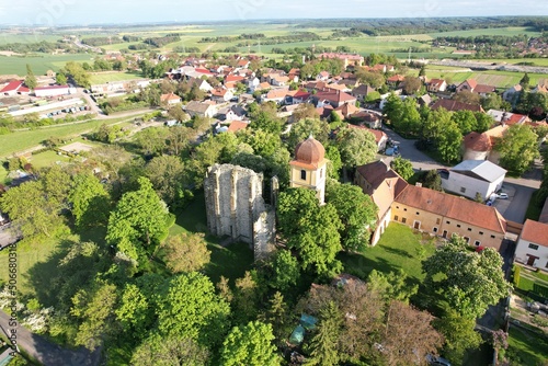 Unfinished Gothic cathedral of Our Lady founded in the 12-th century in the village Panensky Tynec, Czech republic,Europe - magical place full of natural healing Energy,aerial landscape panorama view photo