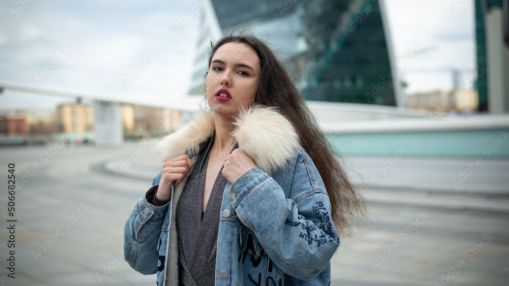 Beautiful girl posing against the backdrop of the urban landscape Beautiful girl posing against the backdrop of the urban landscape