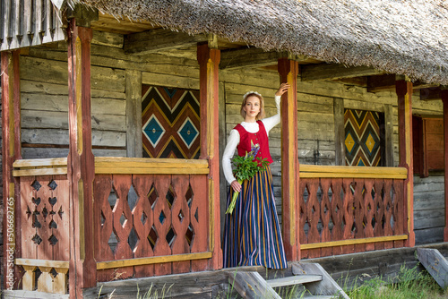 Latvian woman in traditional clothing. Ligo folk.