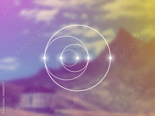 Sacred geometry spiritual new age futuristic illustration with interlocking circles, triangles and glowing particles in front of blurry natural photographic background
