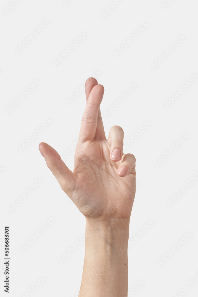 Female crossed fingers isolated on white Female crossed fingers isolated on white