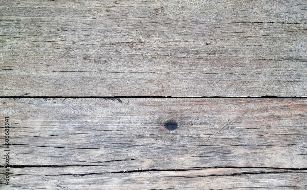 old dry wood texture background. close up grey wooden table showing rough wood grain and wood pith. old plank lumber wood. old dry wood texture background. close up grey wooden table showing rough wood grain and wood pith. old plank lumber wood.