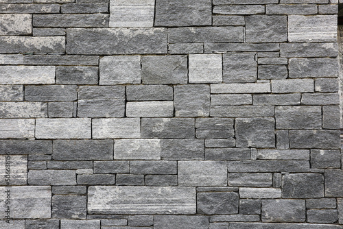 Bricks in a grey Stone Wall